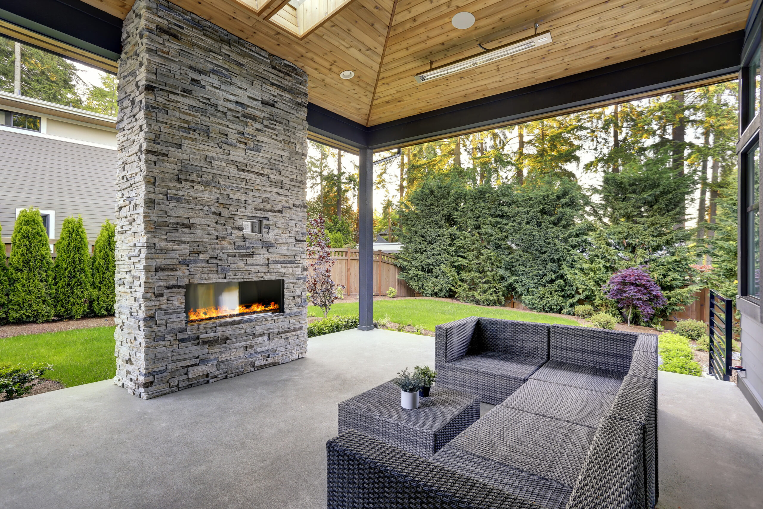 New modern home features a backyard with patio