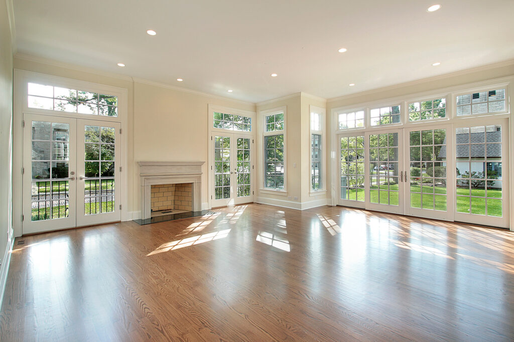 Living room in new construction home with wall of windows