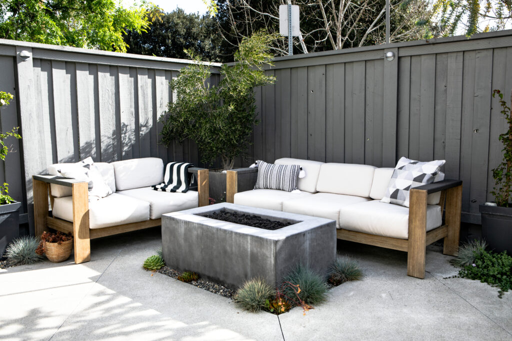 Outdoor wooden couch with a fireplace