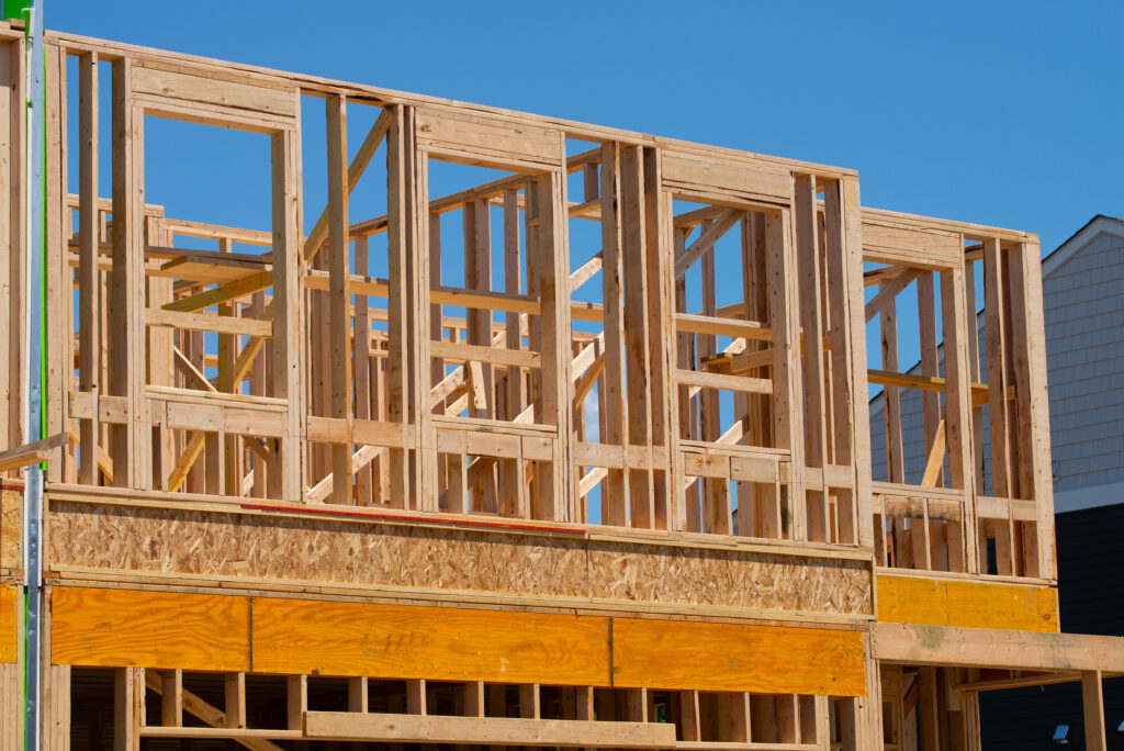 the frame of the second floor of a plywood house wall window