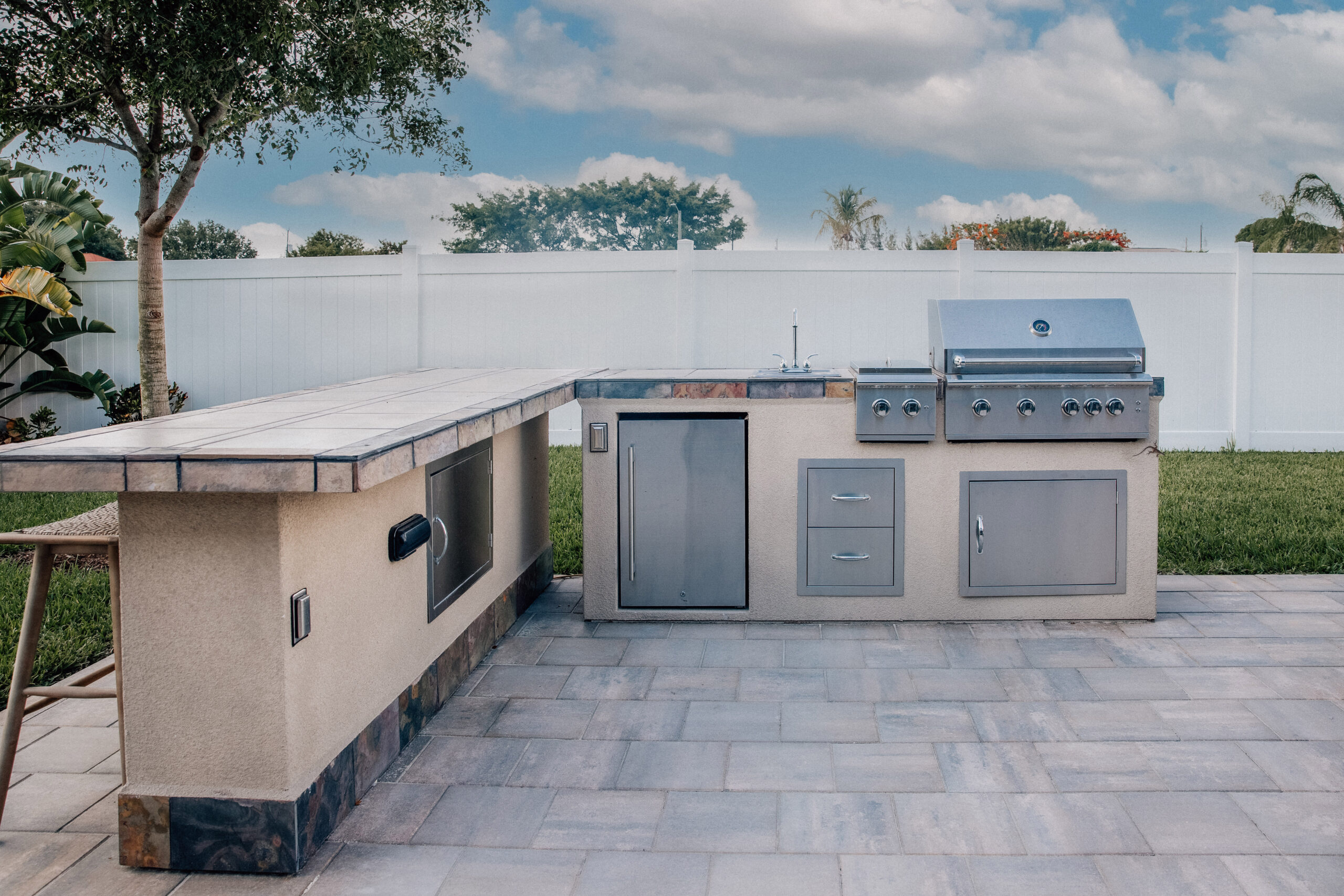 Outdoor kitchen grill grilling station in beautiful back yard